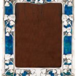 An Art Nouveau silver and enamel frame, Archibald Knox for Liberty & Co, Birmingham, 1910