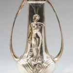 A CONTINENTAL ART NOUVEAU SILVER-PLATED TWO-HANDLED FIGURAL VASE