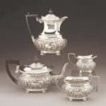 AN EDWARDIAN SILVER FOUR-PIECE SILVER TEA SERVICE