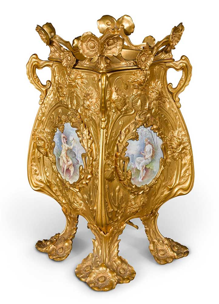 An Art Nouveau style cast-brass and porcelain mounted four-handled jardinière Paris, late 19th century